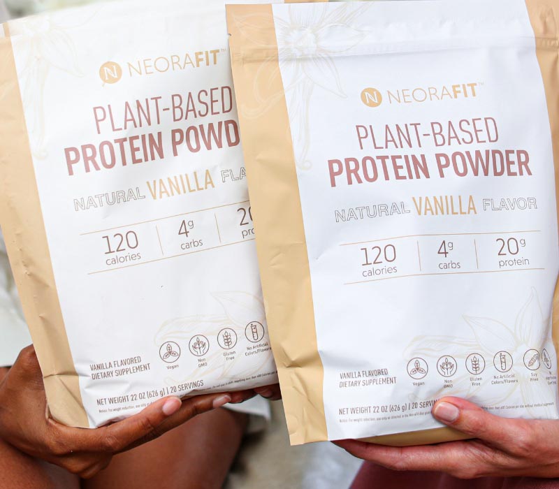 Two women holding NeoaFit Plant-Based Protein Powder in their hands 